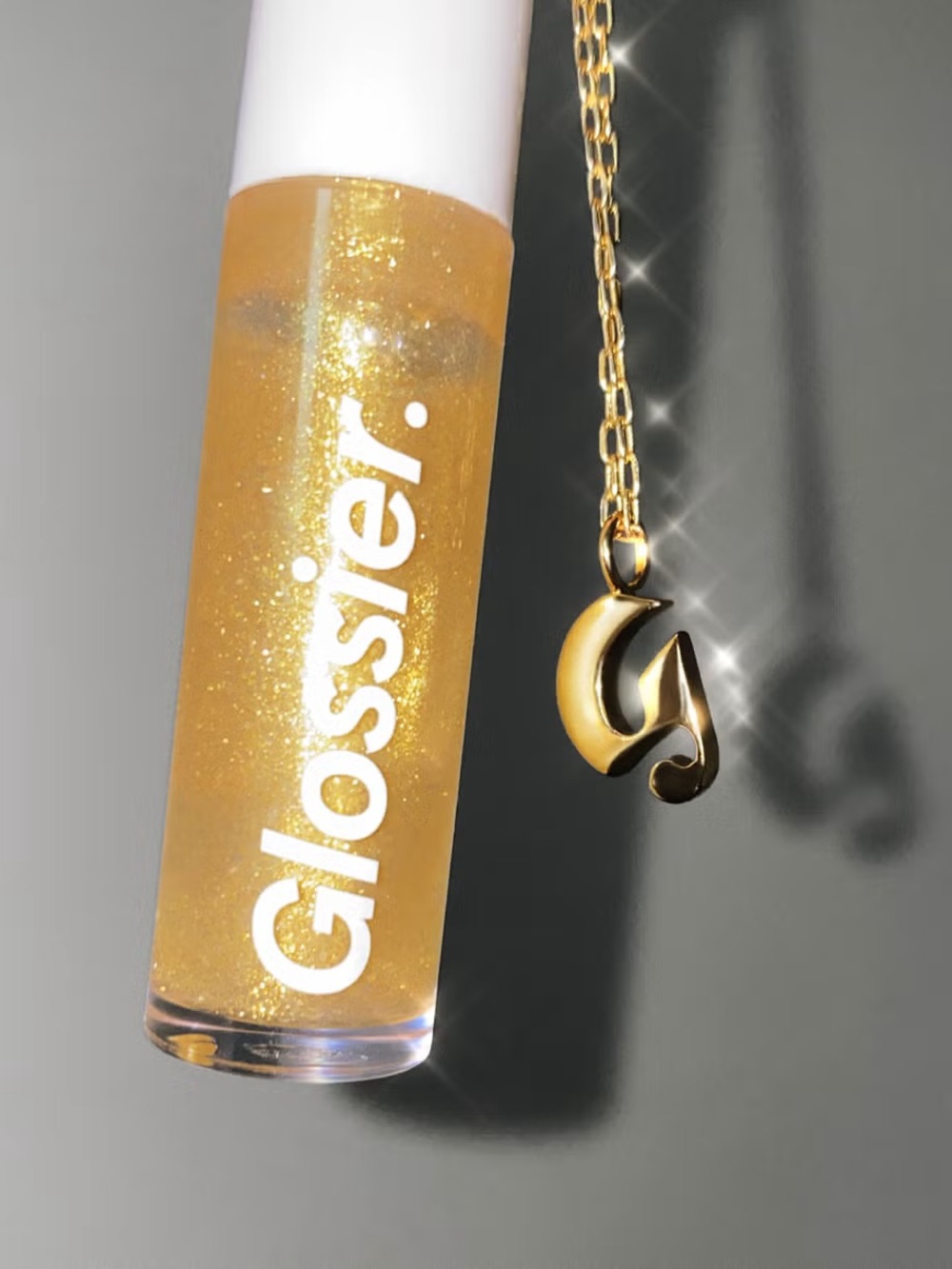Glossier Holiday 2020 “The gold kit” (G necklace and gold shimmer lipgloss)